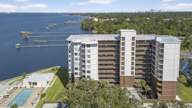 Gated high rise living on the St Johns River! Wake up to