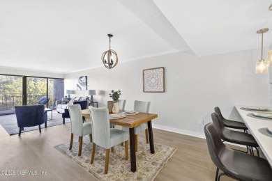 Gated high rise living on the St Johns River! Wake up to