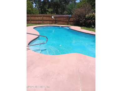 Welcome to this charming 3 bed, 2 bath brick POOL home sitting