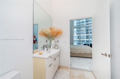 An exquisite 2-bed 2-bath + den residence with breathtaking 16ft