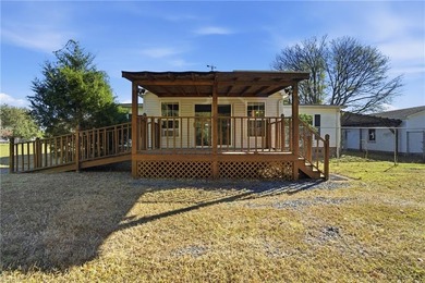 NC Lic # 232478. Enjoy peaceful island living on this spacious 1