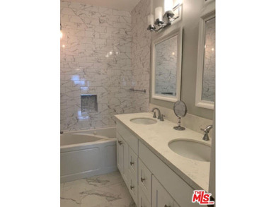 Beautiful, bright, remodeled one-bedroom, two-bath condo