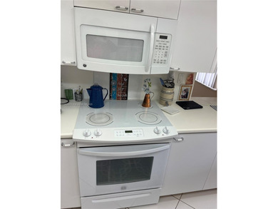 This beautifully maintained 2-bedroom, 2-bath condo offering 1