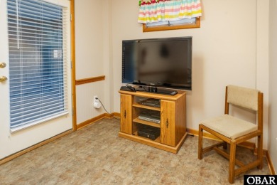 This home, located in Whalehead features a versatile layout