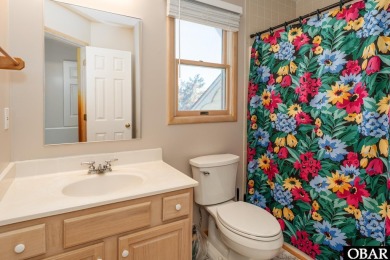 This home, located in Whalehead features a versatile layout