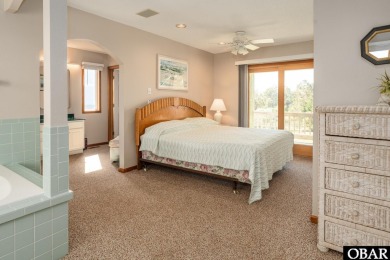 This home, located in Whalehead features a versatile layout