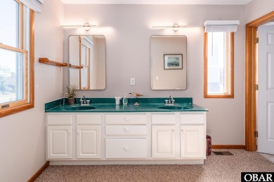 This home, located in Whalehead features a versatile layout