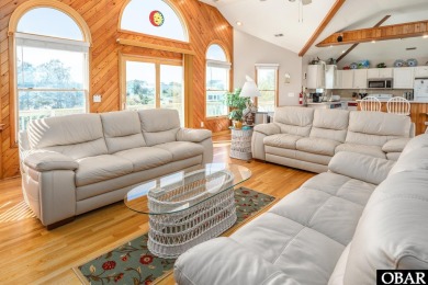 This home, located in Whalehead features a versatile layout