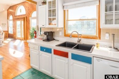 This home, located in Whalehead features a versatile layout