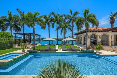 Experience unrivaled waterfront luxury at 210 Palm Avenue, a