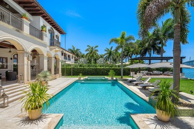 Experience unrivaled waterfront luxury at 210 Palm Avenue, a