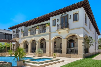 Experience unrivaled waterfront luxury at 210 Palm Avenue, a