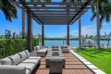 Experience unrivaled waterfront luxury at 210 Palm Avenue, a