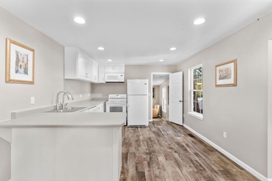 Experience lakeside living at its finest! This beautifully