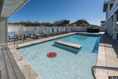 Welcome to this extraordinary 12-bedroom, 10.5-bath custom-built