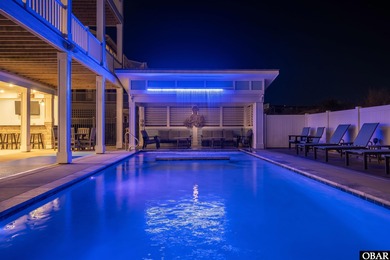 Welcome to this extraordinary 12-bedroom, 10.5-bath custom-built