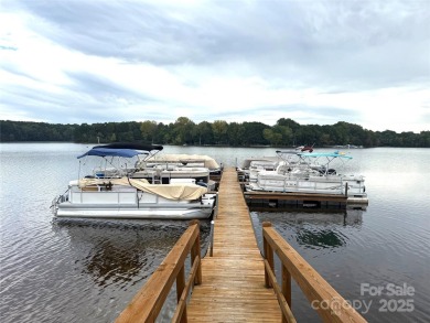 Enjoy lake living in this Spinnaker Point end unit condo on Lake