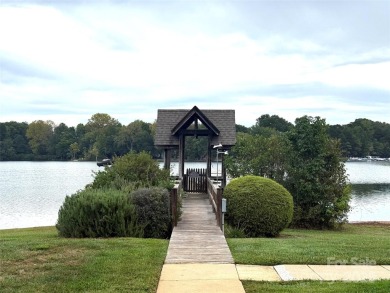 Enjoy lake living in this Spinnaker Point end unit condo on Lake