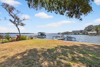 Endless potential awaits with this Cedar Creek Lake waterfront