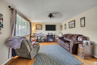 Welcome to this charming West Jordan home featuring 4 spacious