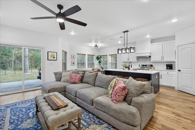 Experience modern lakeside living in this immaculate 2023 home