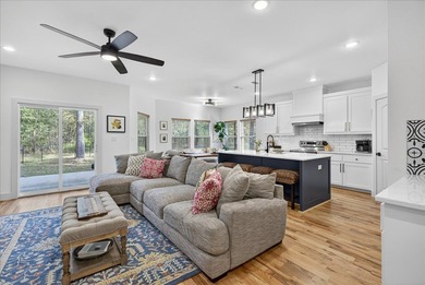 Experience modern lakeside living in this immaculate 2023 home