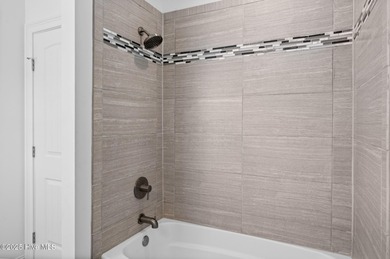 Welcome to your coastal retreat! This bright and inviting 5