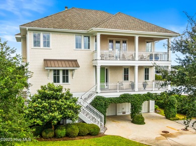 Sweeping views and golden marsh sunsets from this stunning 2014