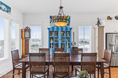 Sweeping views and golden marsh sunsets from this stunning 2014