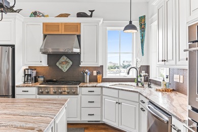 Sweeping views and golden marsh sunsets from this stunning 2014