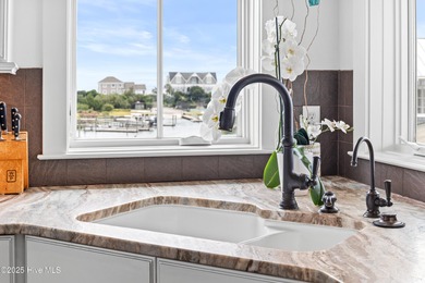 Sweeping views and golden marsh sunsets from this stunning 2014