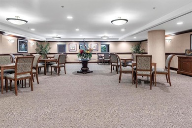 Discover this rare 2-bedroom, 2-bath plus den residence at The