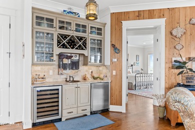 Sweeping views and golden marsh sunsets from this stunning 2014