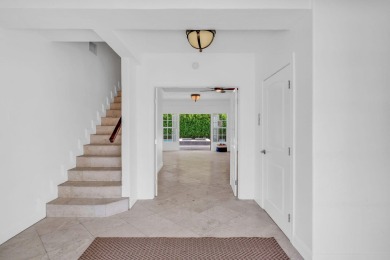 This beautiful home and adjacent lot are located on prestigious