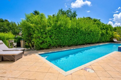 This beautiful home and adjacent lot are located on prestigious