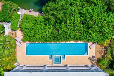 This beautiful home and adjacent lot are located on prestigious