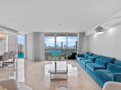 Commanding the skyline of Aventura, this Peninsula II penthouse