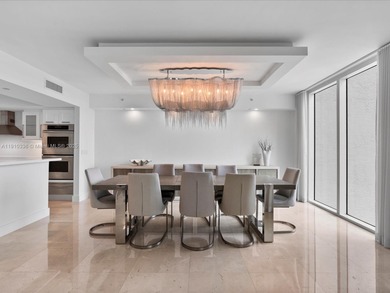 Commanding the skyline of Aventura, this Peninsula II penthouse