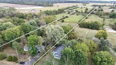 Charming Country Retreat with 11+ Acres and Development