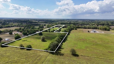 Charming Country Retreat with 11+ Acres and Development