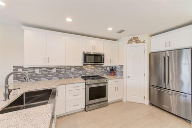 Stunning waterfront townhome just steps from the beach! Built in