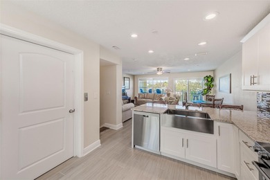 Stunning waterfront townhome just steps from the beach! Built in