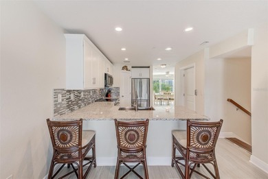 Stunning waterfront townhome just steps from the beach! Built in