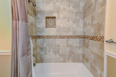 Stunning waterfront townhome just steps from the beach! Built in