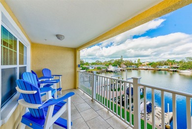 Stunning waterfront townhome just steps from the beach! Built in