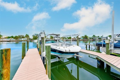 Stunning waterfront townhome just steps from the beach! Built in