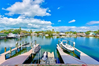 Stunning waterfront townhome just steps from the beach! Built in