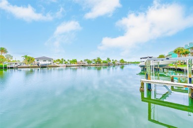 Stunning waterfront townhome just steps from the beach! Built in