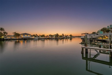 Stunning waterfront townhome just steps from the beach! Built in