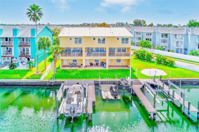 Stunning waterfront townhome just steps from the beach! Built in